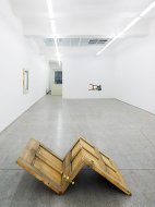 Up Side Down (On Knees and Nose), 2008, entrance door, various materials, 49 x 152 x 88 cm
